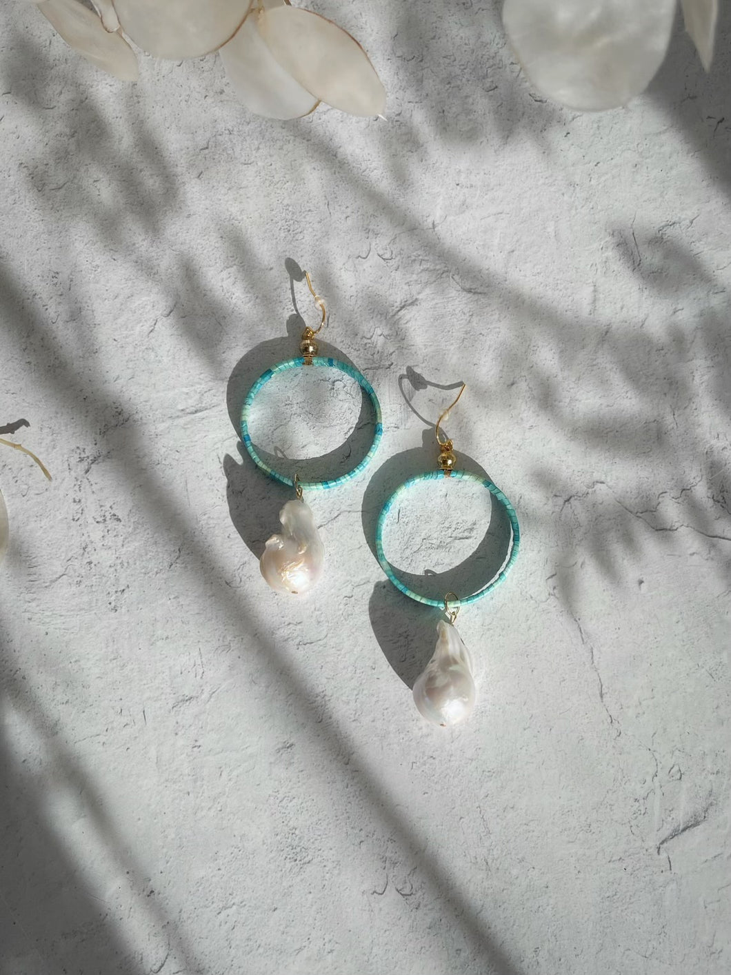 Large turquoise quilled hoops with elk tooth shaped pearls