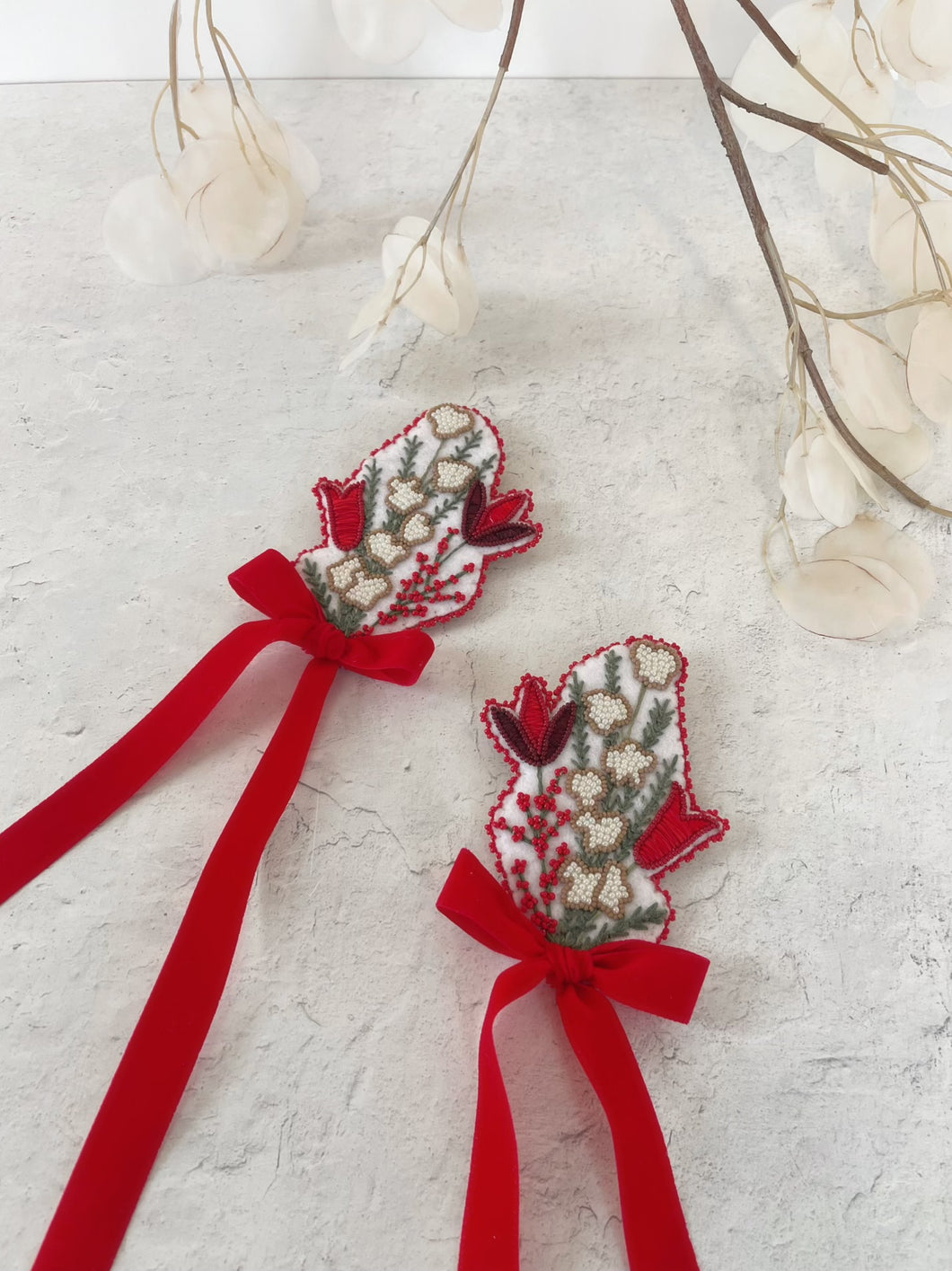 Matching winter floral brooches